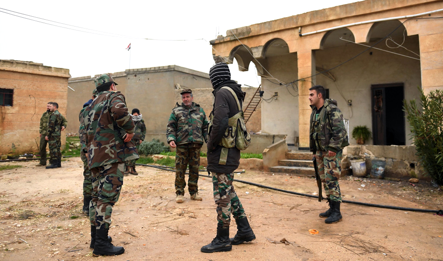 Syrian regime forces gather in the southern countryside of the northern Kurdish-controlled city of Manbij on Dec. 30, 2018. (AFP)