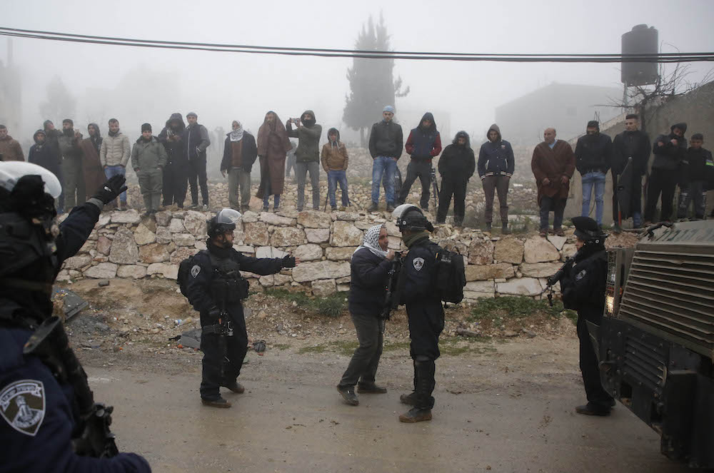 A Palestinian man argues with an Israeli border guard this month in Hebron, where international observers have been based since 1994. AFP