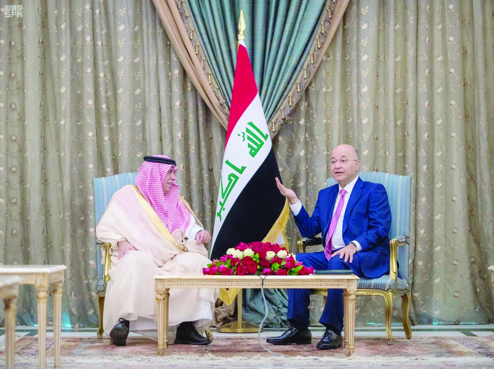 Saudi Minister of Commerce and Investment Majid bin Abdullah Al-Qassabi meets Iraqi President Barham Salih in Baghdad on Thursday. (SPA)