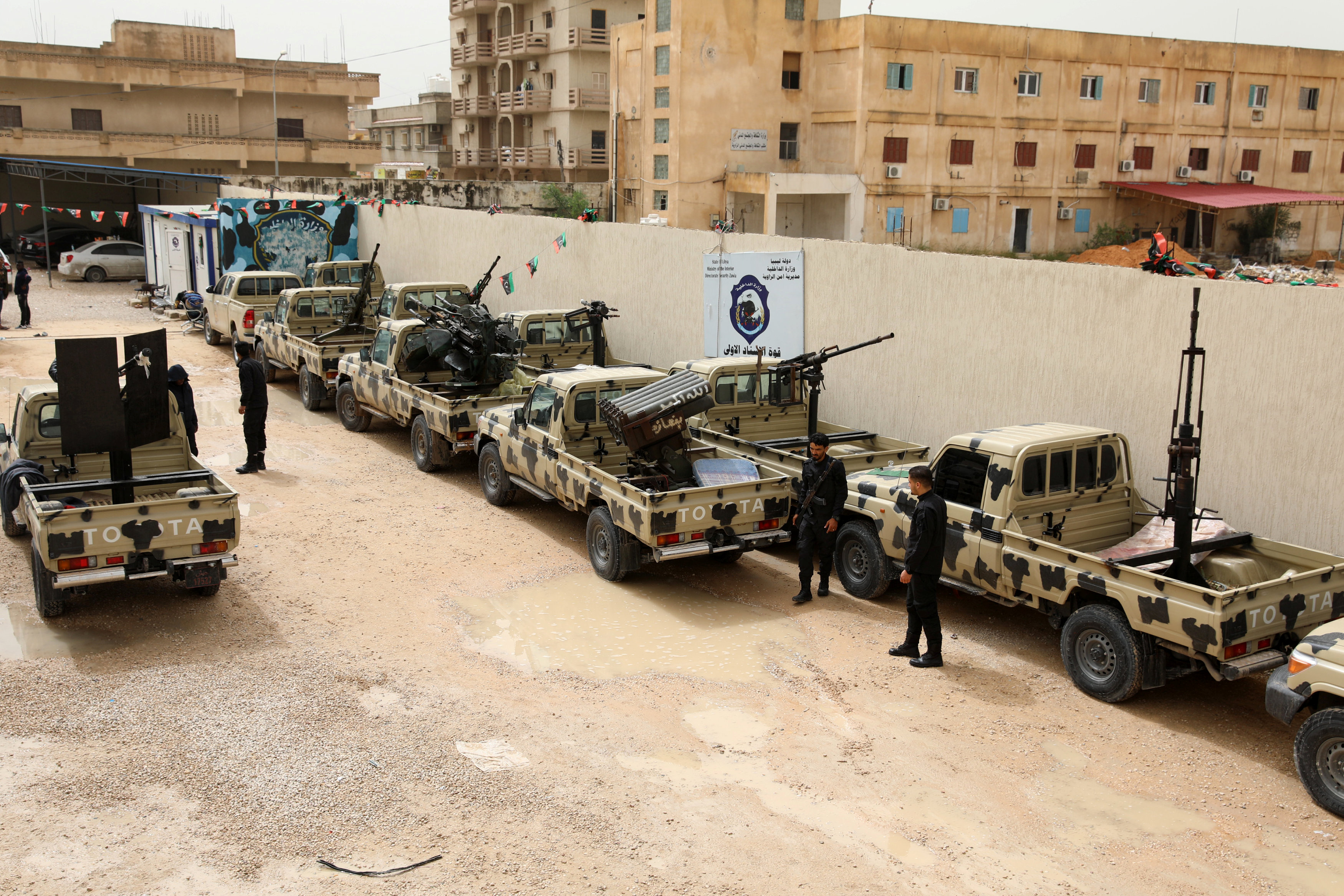 Members of the Libyan forces loyal to the Tripoli government check military vehicles they claimed were confiscated from Libyan commander Khalifa Haftar's troops, in Zawiyah, west of Tripoli. (Reuters)