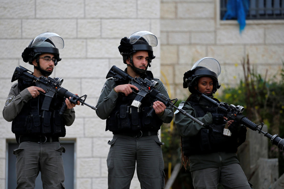 Israeli border police members stand guard during the demolition of a Palestinian house. (Reuters/file)