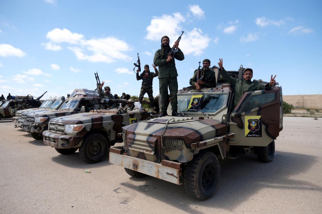 Libyan National Army (LNA) members, commanded by Khalifa Haftar, pose for a picture as they head out of Benghazi to reinforce the troops advancing to Tripoli, in Benghazi, Libya April 7, 2019. (Reuters)