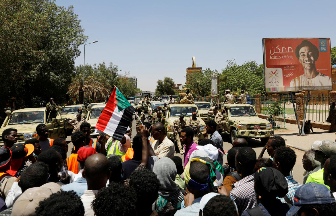 Sudanese demonstrators chant slogan in front of security forces during a protest in Khartoum, Sudan April 15, 2019. (Reuters)