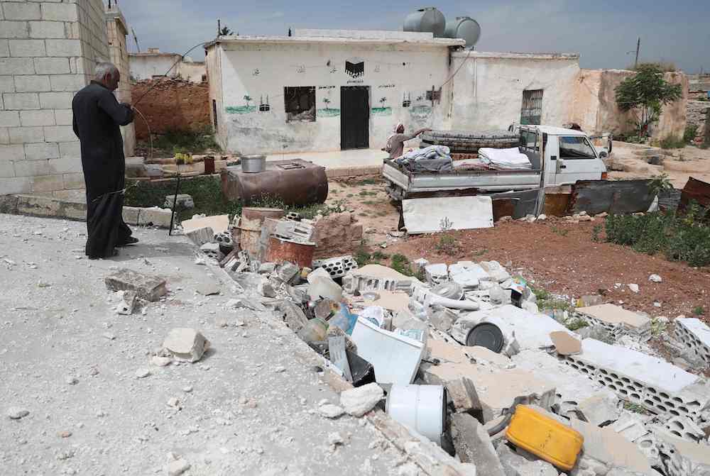 Syrians prepare to leave their houses in the village of Rabaa Jour in the the militant-held Syrian province of Idlib on May 6, 2019 following reported shelling and air strikes in the area. (AFP)