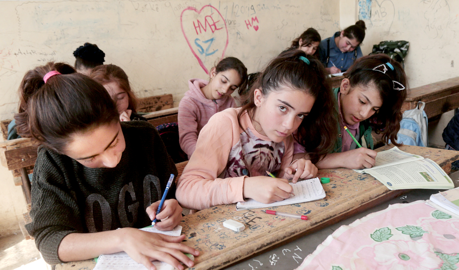 Kurdish students attend class at a school in Qamishli, Syria. (Reuters)