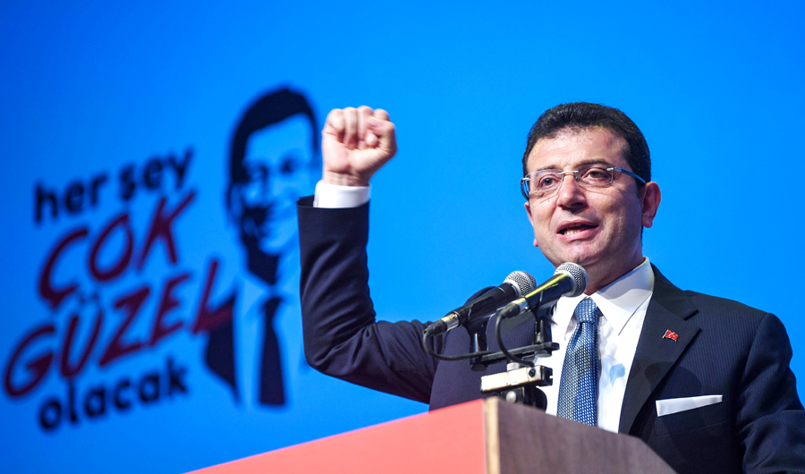 Turkey’s deposed mayor, Ekrem Imamoglu, delivers a speech during his repeated political campaign coordination meeting on Wednesday in Istanbul. (AFP)