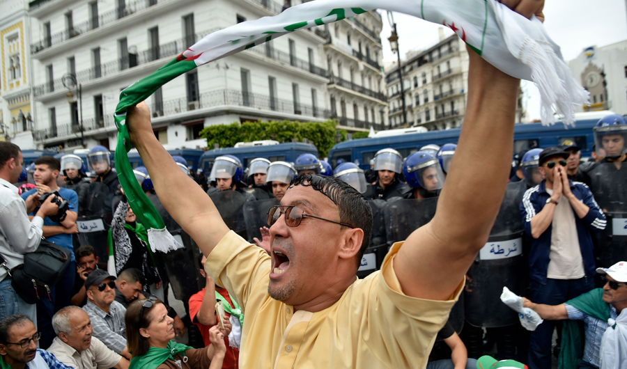 A protester shouts slogans during a demonstration in Algiers. (AFP)