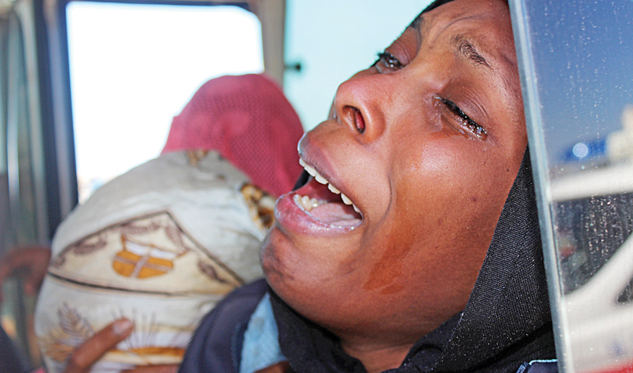 A woman reacts after her child died, after a boat accident off the Libyan coast, in Qarabulli town, east of the capital Tripoli. (Reuters)
