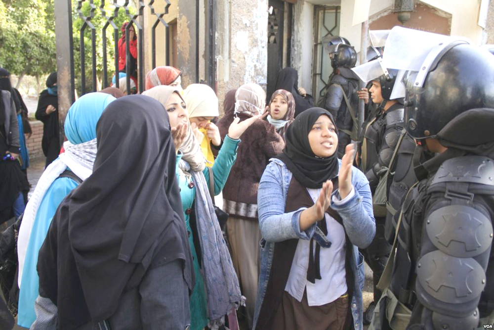 Female students clash with police at Al-Azhar University in Cairo.