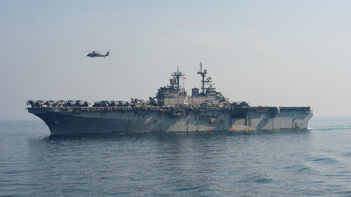A SH-60 Sea Hawk flies over the amphibious assault ship USS Boxer (LHD 4) during a vertical replenishment-at-sea, Arabian Sea off Oman, July 19, 2019. (Reuters/US Navy)