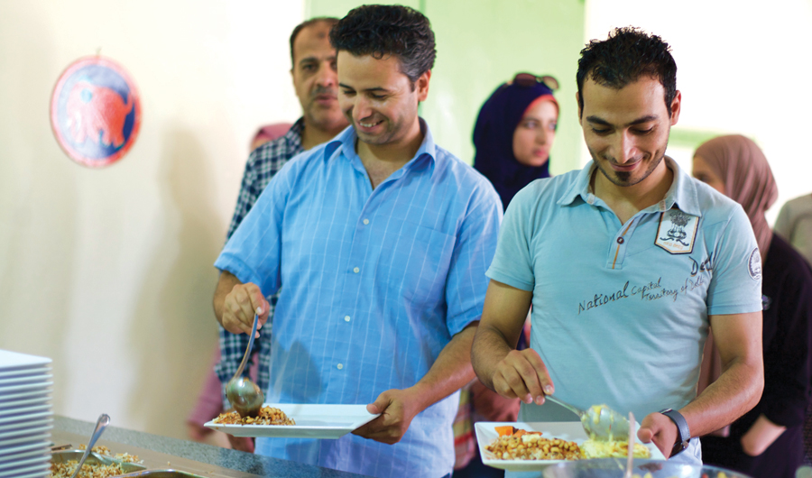 Sekem cafeteria workers prepare food. (Supplied)