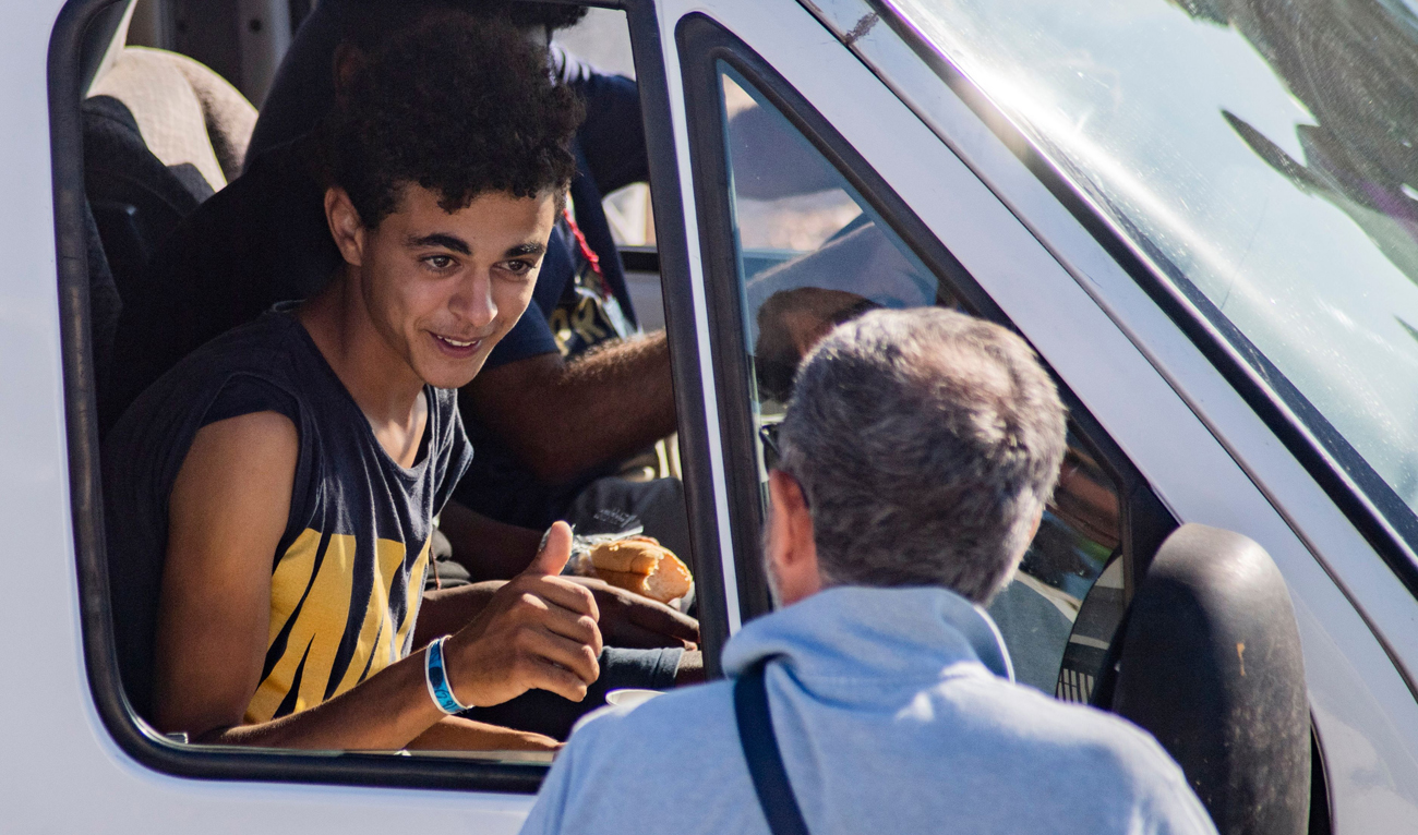 The boat had spent six days anchored off Lampedusa before a local prosecutor ordered the migrants be allowed to land. (AFP)