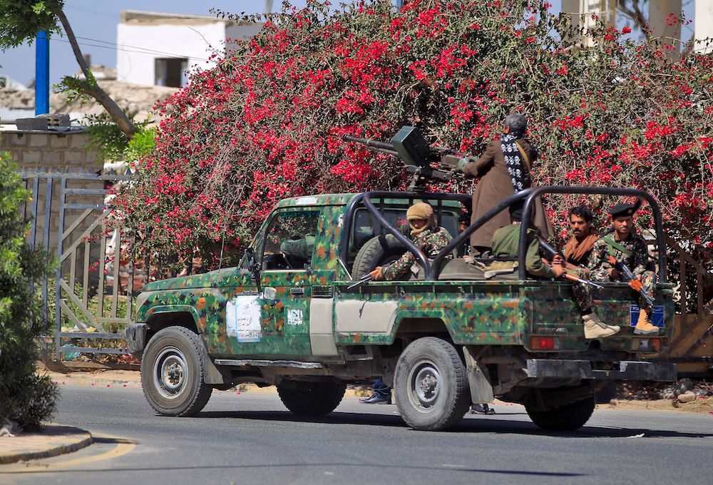 Houthi militants on Thursday patrolling the streets of Sanaa, which they seized from the government in 2014. (AFP)