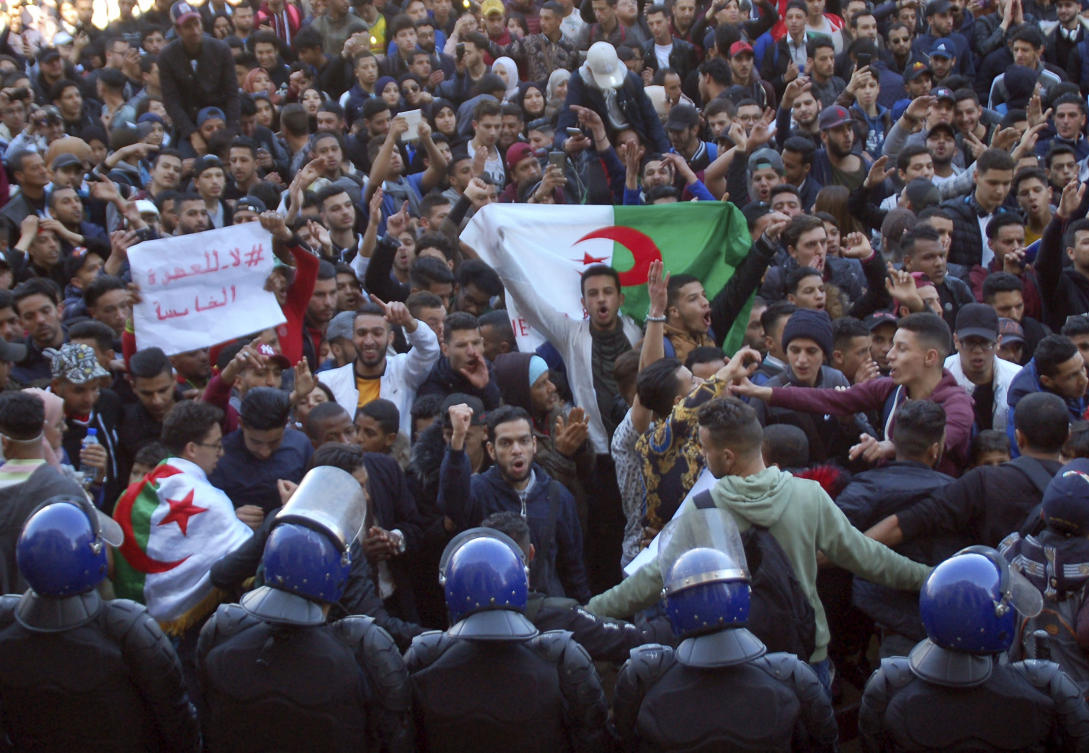 Algerian students take part in a protest against ailing President Abdelaziz Bouteflika's bid for a fifth term at Place d'Armes in the city of Oran on February 26, 2019. (AFP)
