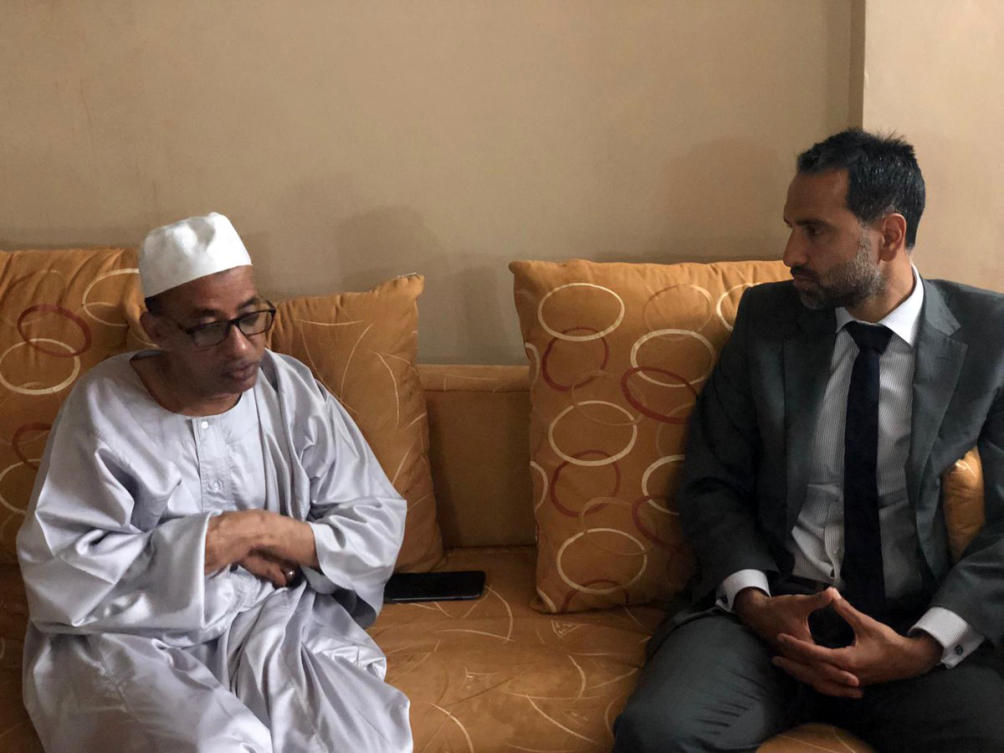 A handout picture released by the British Embassy in Khartoum on March 5, 2019, shows Irfan Siddiq (R), British ambassador in Khartoum, meets with Omar el-Digeir, the chief of the opposition Sudanese Congress Party, upon his release in Khartoum. (AFP)
