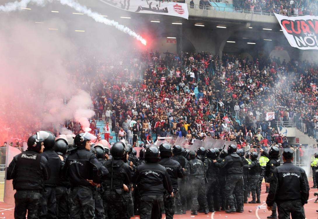 Referee suspended and claims of match fixing after fans riot in ...