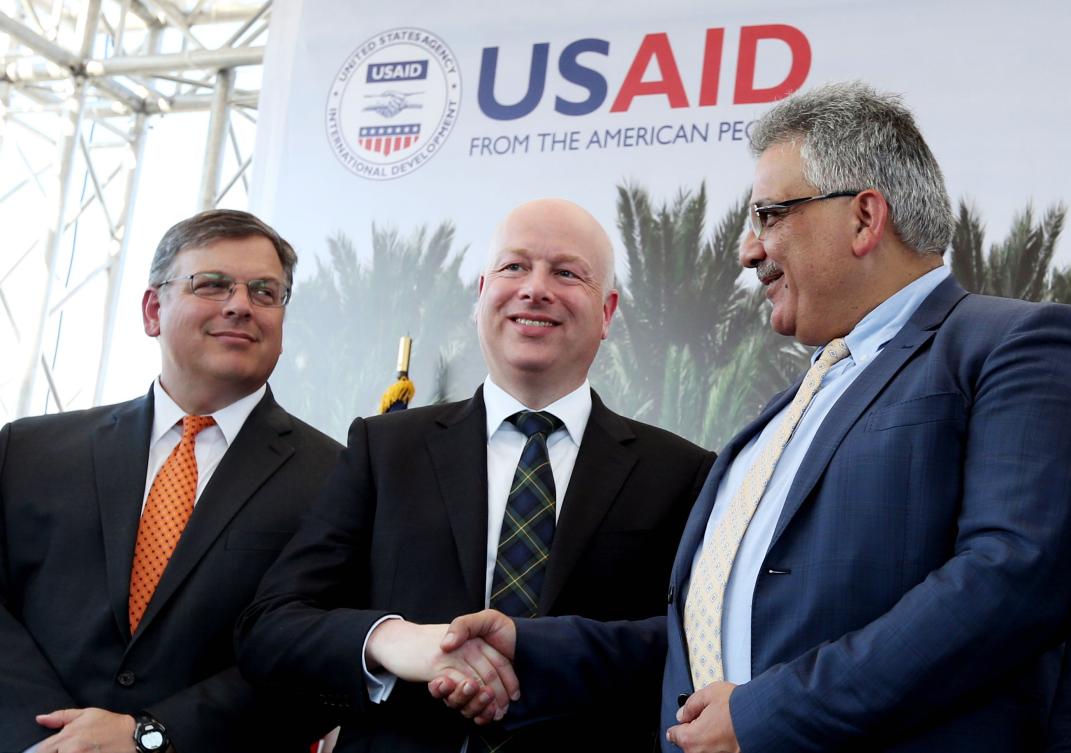 In this file photo taken on October 15, 2017, US special envoy Jason Greenblatt (C) shakes hands with Palestinian Water Authority chairman Mazen Ghunaim during the launch of a project to improve access to wastewater treatment and water for Palestinian farmers, in Jericho. (AFP)