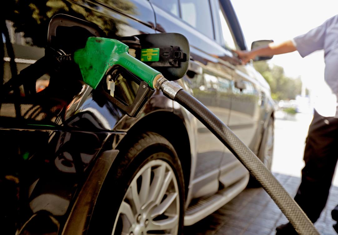 A driver fills his tank at a petrol station in the Lebanese capital Beirut on September 27, 2019. (AFP)