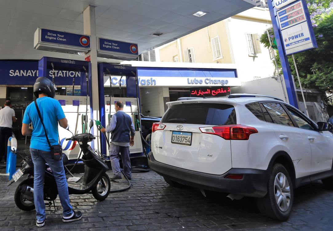 Drivers fill up at a petrol station in the Lebanese capital Beirut on September 27, 2019. (AFP)