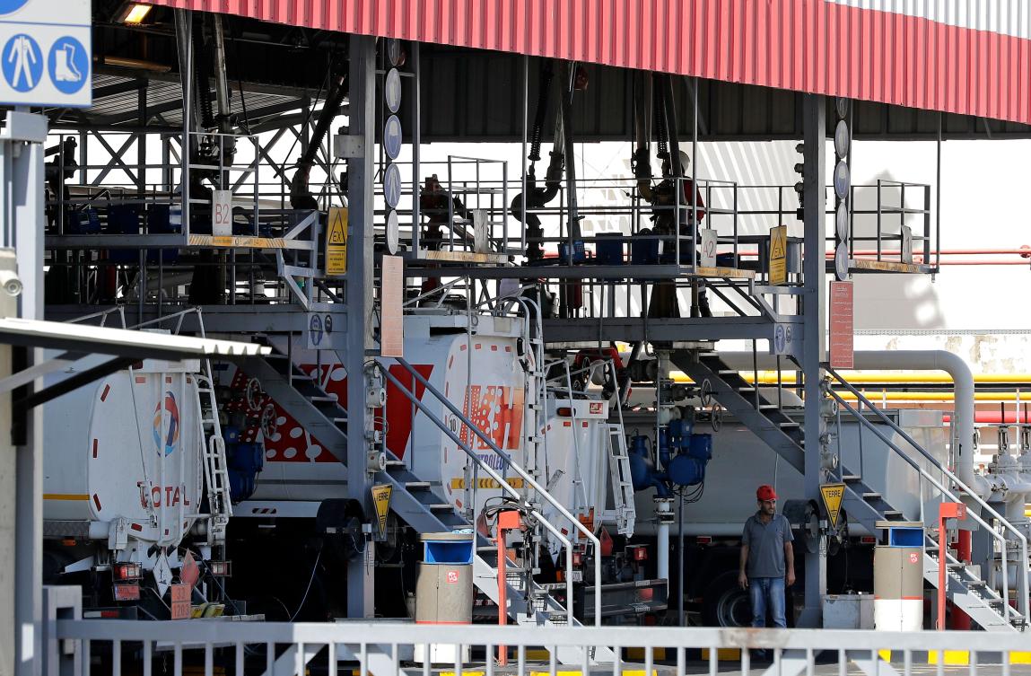 Fuel trucks fill up at a distribution station of French oil giant Total in the Lebanese capital Beirut on September 27, 2019. (AFP)