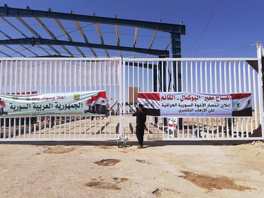 An Iraqi border guard stands guard during the opening ceremony of the crossing between the Iraqi town of Qaim and Syria's Boukamal in Anbar province of Iraq on Monday, Sept. 30, 2019. (AP)