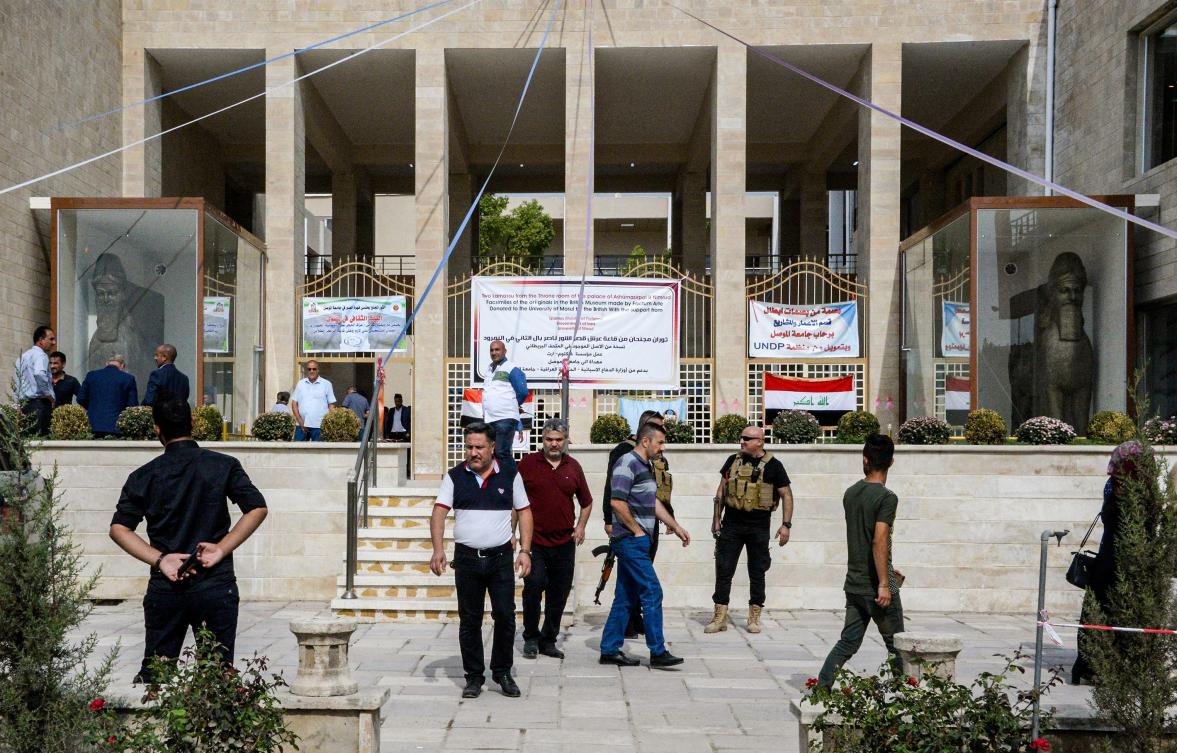 This picture taken on October 24, 2019 shows two replicas of "lamassu", an Assyrian protective deity depicted with a human head, the body of a lion, and bird wings, on display on the day of their unveiling at the University of Mosul in the northern Iraqi city. (AFP)