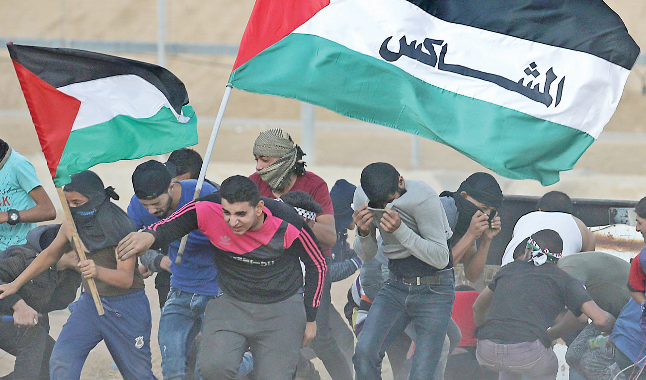 Palestinian demonstrators react during a recent anti-Israel protest in the southern Gaza Strip. (Reuters)