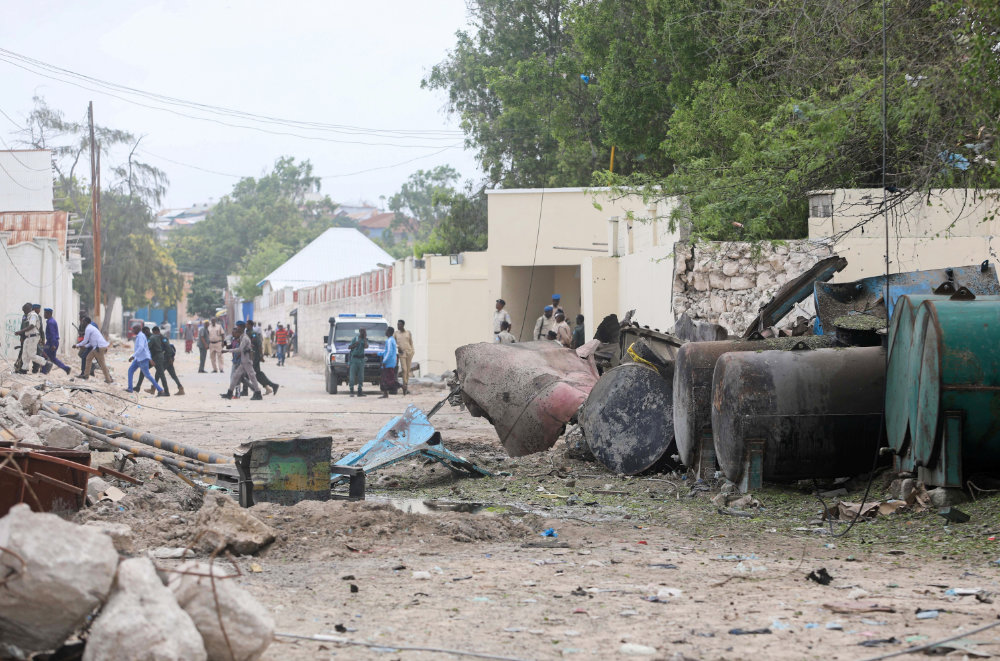 A general view shows Somali policemen at the scene after suicide car bomber drove into a checkpoint outside the port in Mogadishu, Somalia, on July 4, 2020.(REUTERS/Feisal Omar)