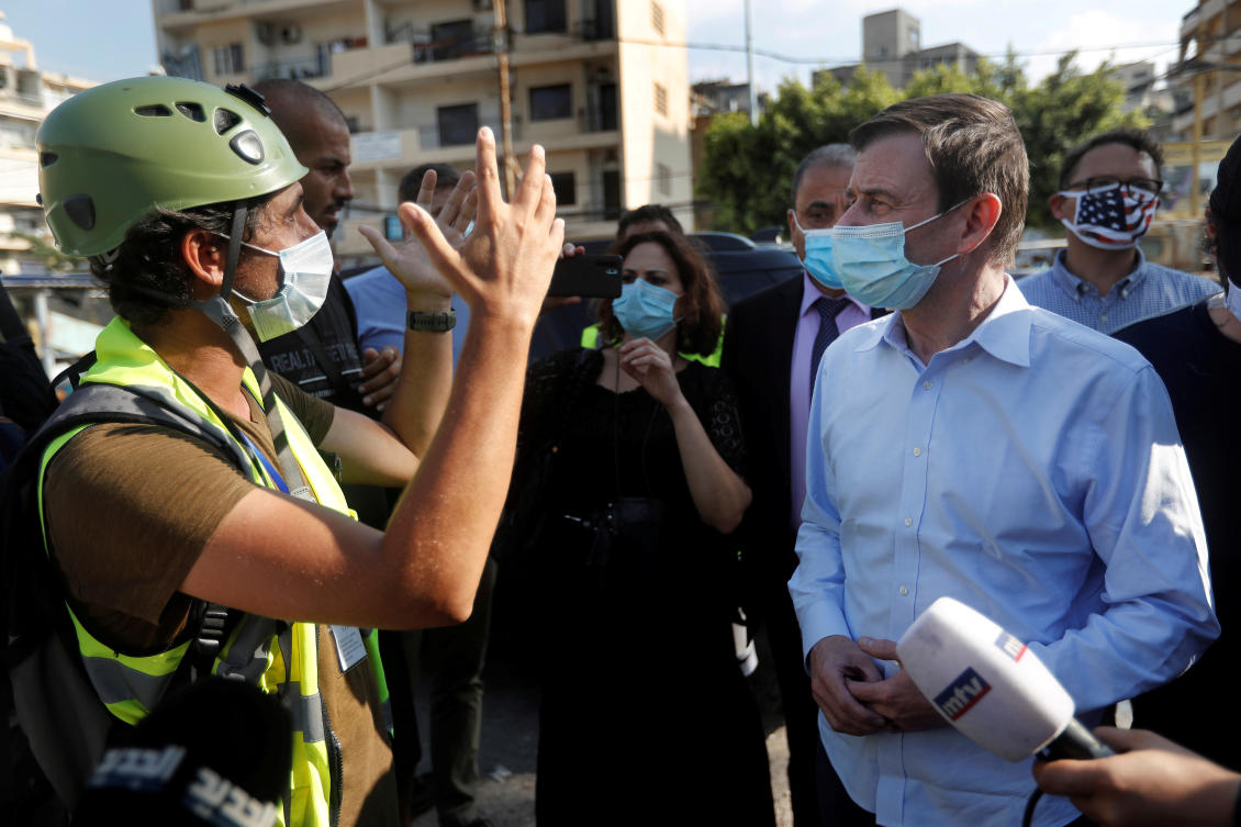 US Under Secretary of State for Political Affairs David Hale, listens to an NGO volunteer during his visit to a main NGOs gathering point near the scene of the last week's explosion that hit the seaport of Beirut, Lebanon August 13, 2020. (Reuters)
