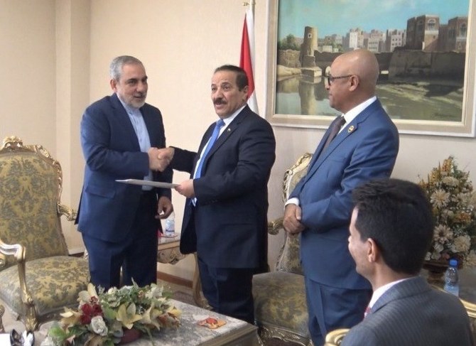 Iran's representative, Hasan Irlu, (left) with the Houthis' self proclaimed foreign minister Hesham Sharaf Abdallah in Sanaa in October. (Handout)