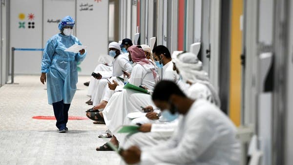 People sit as they wait their turn for vaccine trials in Abu Dhabi, UAE, Oct. 6, 2020. (File/Reuters)