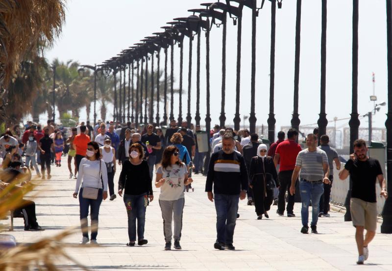 People walk along Beirut’s seaside Corniche in Beirut, Lebanon. (File/Reuters)