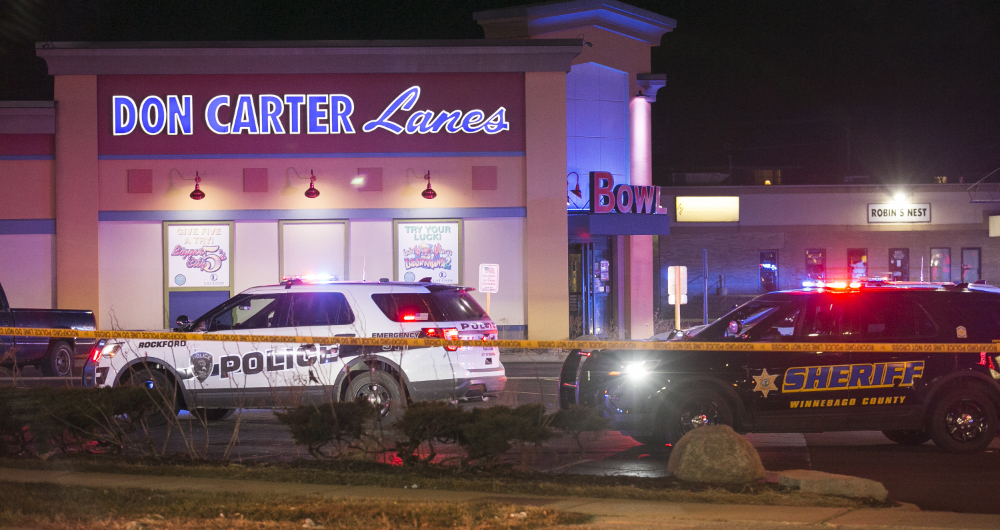 Rockford police and other law enforcement agencies investigate the scene of a shooting at a bowling alley in Rockford, Ill. (Rockford Register Star via AP)