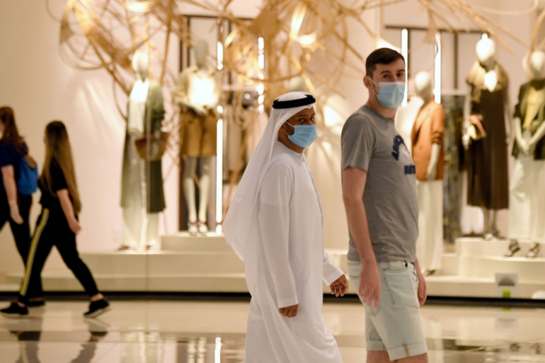 People wearing protective face masks walk on Dubai mall in the UAE. (File/AFP)
