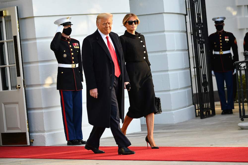 US President Donald Trump and First Lady Melania make their way to board Marine One before departing from the South Lawn of the White House in Washington, DC on January 20, 2021. (AFP)