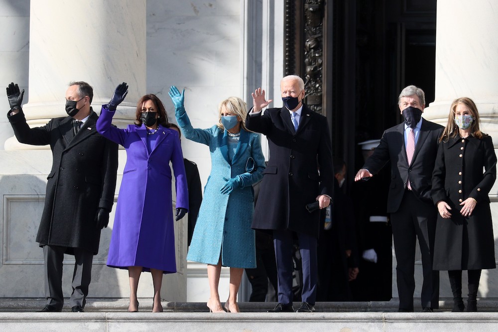 Doug Emhoff, U.S. Vice President-elect Kamala Harris, Jill Biden and President-elect Joe Biden wave as they arrive on the East Front of the US Capitol for the inauguration on January 20, 2021. (AFP)
