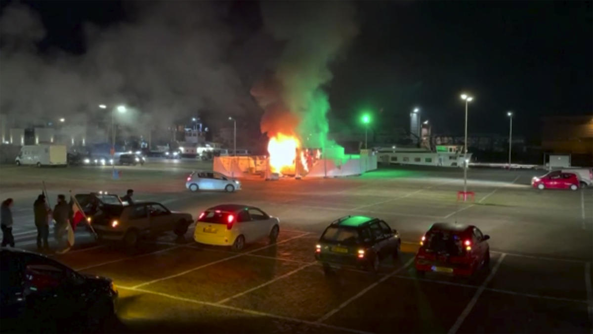 In this image made from video, a COVID-19 testing center is seen after being set on fire in Urk, 80 kilometers northeast of Amsterdam, on Jan. 23, 2021. (Pro News via AP)