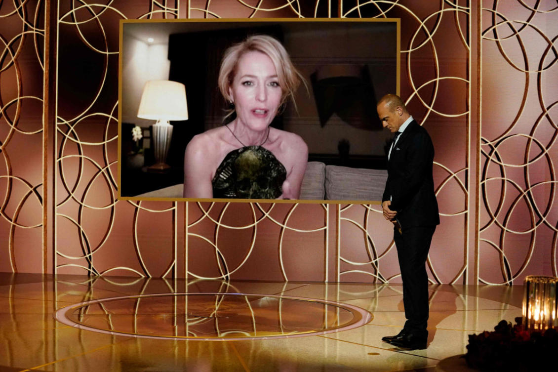 Gillian Anderson (on screen) accepts the Best Supporting Actress – Television award for "The Crown" via video by Christopher Meloni onstage at the 78th Annual Golden Globe Award. (AFP PHOTO /NBCUniversal)