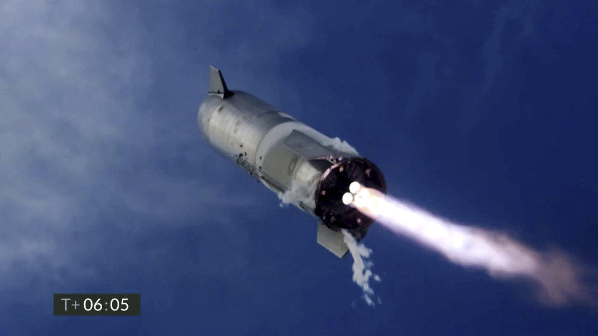 In this image from video made available by SpaceX, one of the company's Starship prototypes fires its thrusters as it lands during a test in Boca Chica, Texas, on March 3, 2021. (SpaceX via AP)