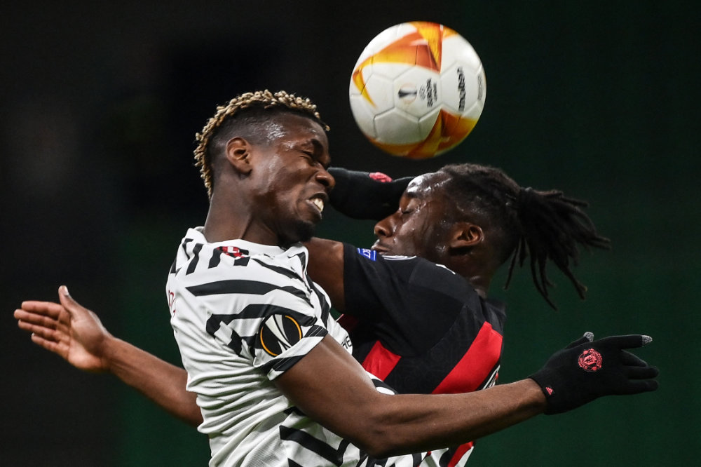 Manchester United’s Paul Pogba, left, and  Souhaliho Meite of AC Milan  during their  Europa League round of 16 second leg match. (AFP)