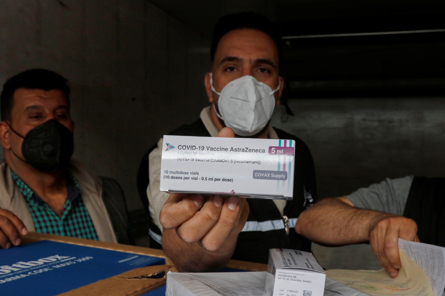 A man shows a box containing the AstraZeneca vaccine against the coronavirus disease (COVID-19) at Baghdad International Airport, in Baghdad, Iraq March 25, 2021. (Reuters)