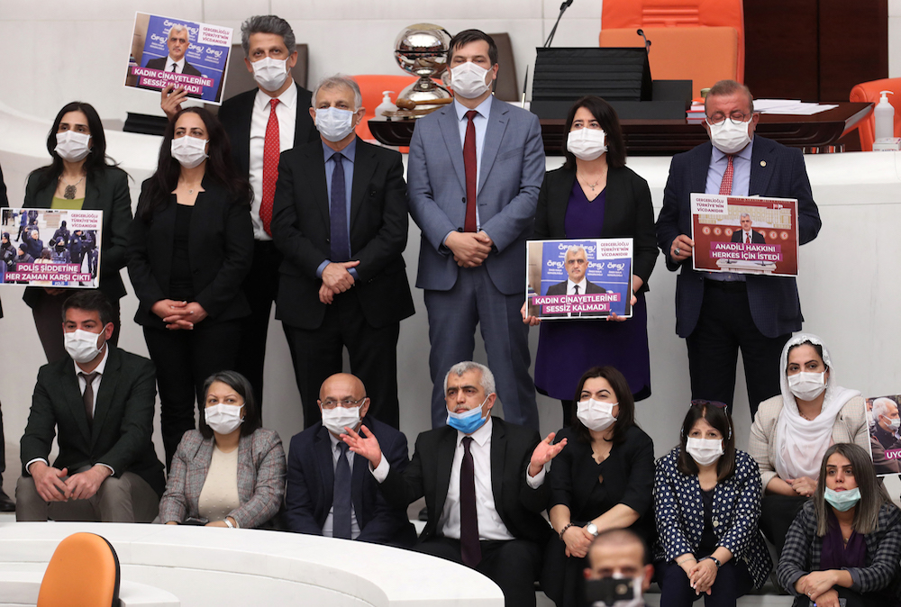 Omer Faruk Gergerlioglu (C), a human rights advocate and lawmaker from the People's Democratic Party (HDP) and his colleagues pose after the parliament stripped his parliamentary seat, in Ankara, on March 17, 2021. (AFP)