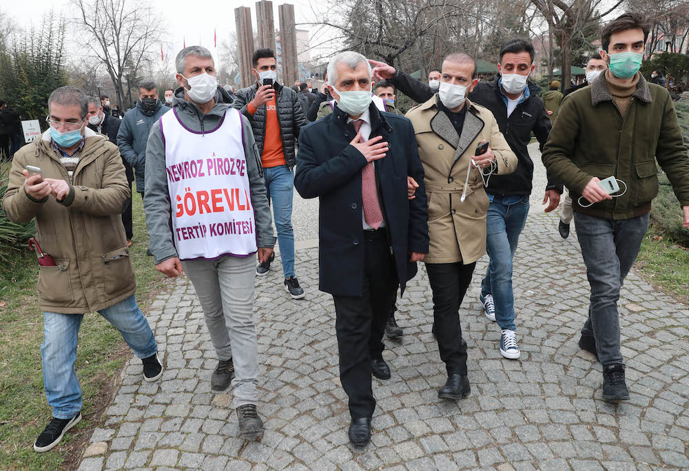 Peoples' Democratic Party (HDP) MP Omer Faruk Gergerlioglu who has been detained inside the Parliament and later released, gestures as he is prevented by police to attend Nowruz celebrations in Ankara, on March 21, 2021. (AFP)