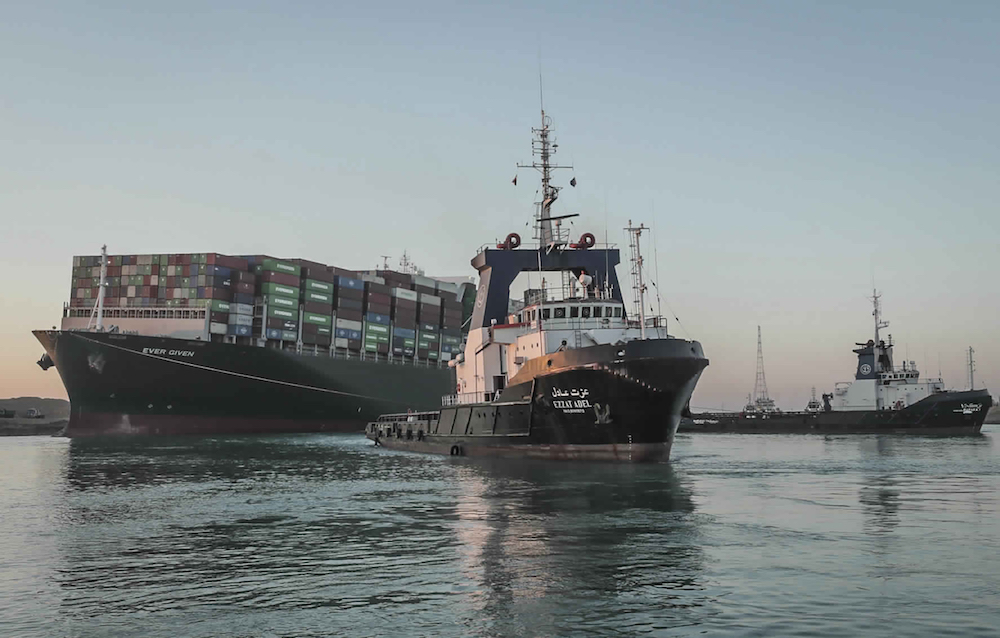 The Ever Given, a Panama-flagged cargo ship is pulled by one of the Suez Canal tugboats, in the Suez Canal, Egypt, Monday, March 29, 2021. (AP/Suez Canal Authority) The Ever Given, a Panama-flagged cargo ship is pulled by one of the Suez Canal tugboats, in the Suez Canal, Egypt, Monday, March 29, 2021. (AP/Suez Canal Authority)