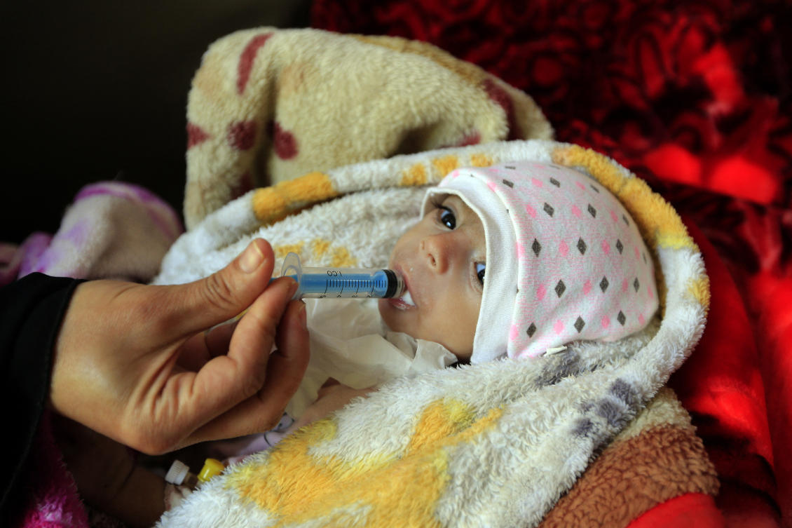 A Yemeni mother feeds her malnourished child at Al-Sabeen Maternity and Child Hospital in the Houthi-rebel-held Yemeni capital Sanaa. (File/AFP)