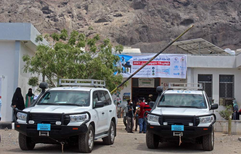 UN vehicles are seen outside a vaccination center in Al-Maala district in Yemen’s southern city of Aden on April 20, 2021. (AFP)