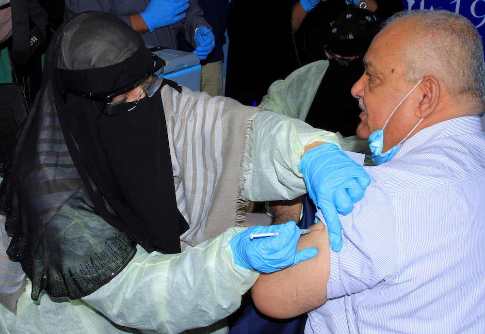 Minister of Civil Service Abdul-Nasser Al-Wali, receives the AstraZeneca COVID-19 vaccine at a medical center in Aden, Yemen April 20, 2021. (Reuters)