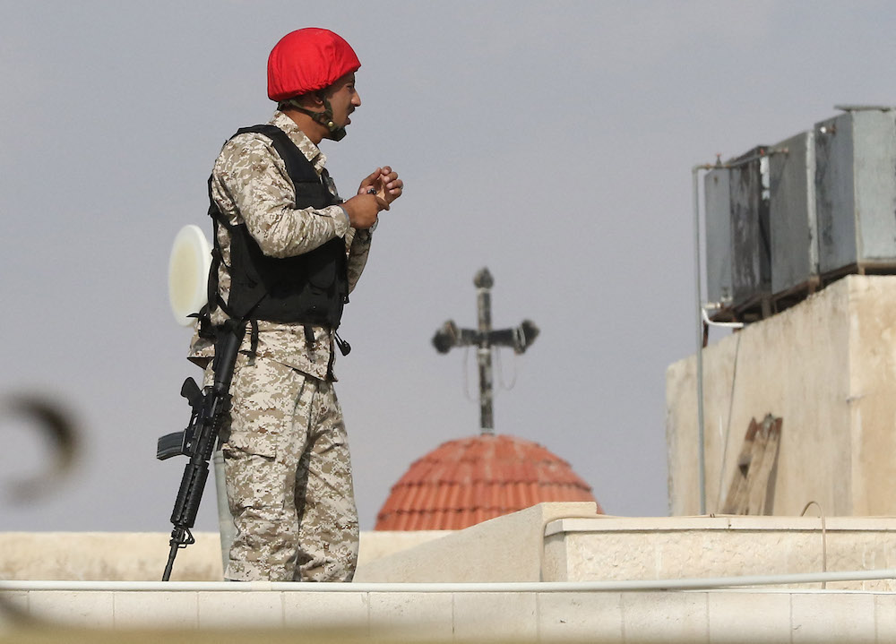 A Jordanian policeman stands guard outside the military State Security Court in the Jordanian capital of Amman. (File/AFP)