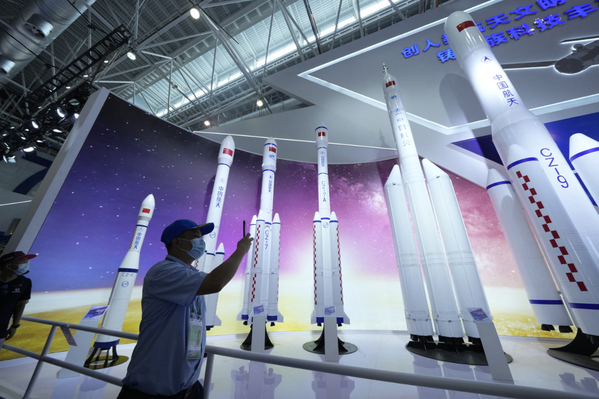 Replicas of space launch rockets are shown as Airshow China 2021 in Zhuhai. China says its launch of a new spacecraft was merely a test to see whether the vehicle could be re-used. (AP file photo) 
