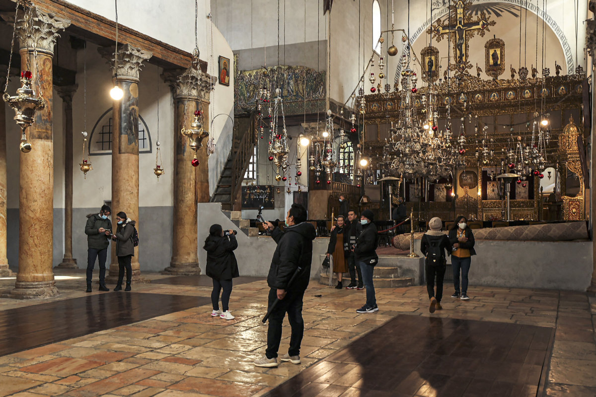 Christian worshippers visit the Greek Basilica at the Church of the Nativity on Dec. 19, 2021. (AFP)